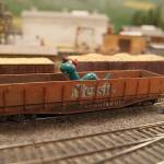 The Loch Ness Monster peeks out from a pile of gold ore.