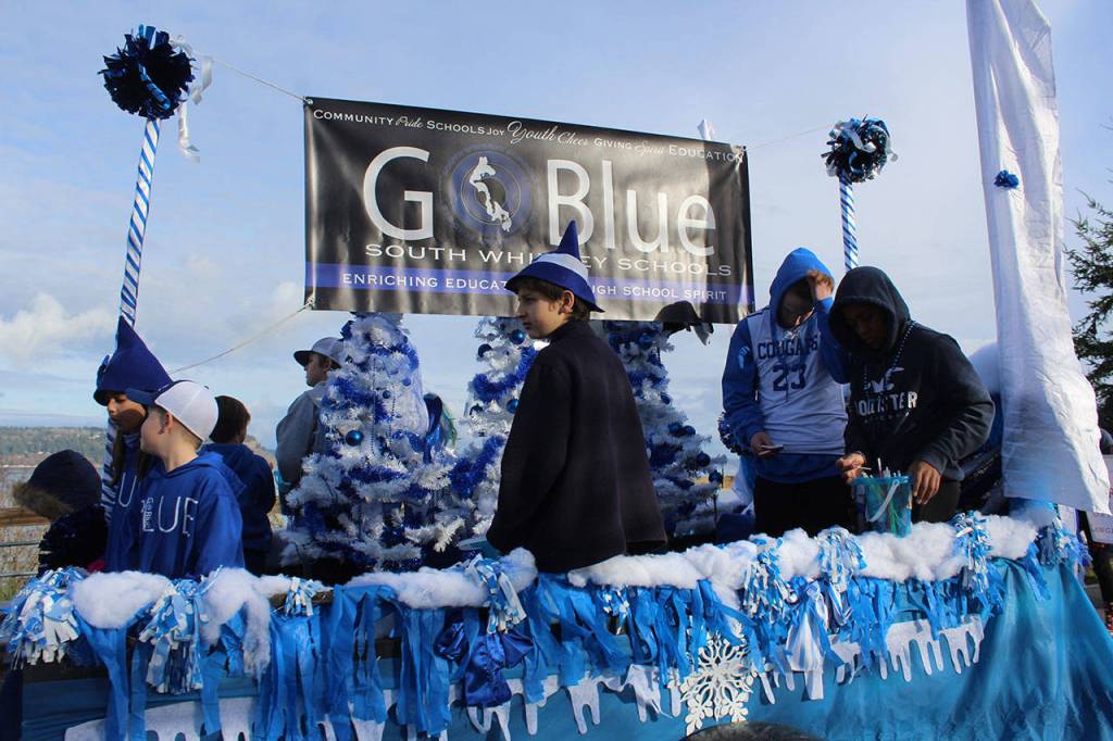 The boisterous Go Blue loud, proud and shimmering blue and white booster float of South Whidbey Schools won a parade award for Most Spirited.