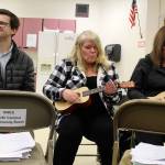 James Nelson, Karyn Lewarne, center, and Leslie Ballestrasse play during a recent session of the Guitars in the Classroom program offered to staff of the South Whidbey School District. (Photos by Patricia Guthrie/Whidbey News Group)