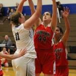 Lexi Starets-Foote, left, shoots over the defense of Port Townsends Izzy Hammett.(Photo by Jim Waller/South Whidbey Record)