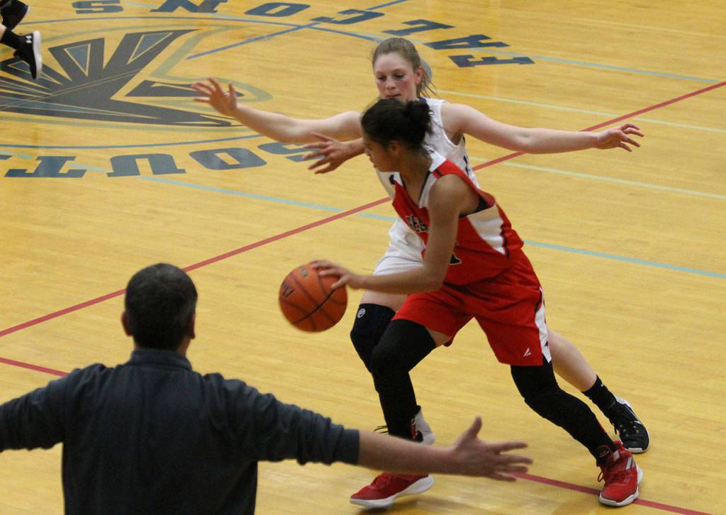 South Whidbey coach Jeff Hanson reminds Emma Hodson, back, of proper defensive technique.(Photo by Jim Waller/South Whidbey Record)