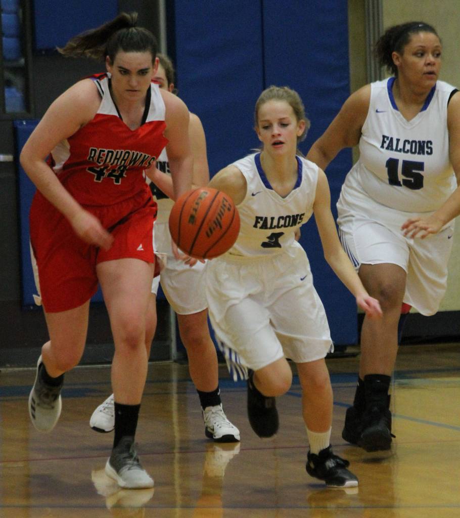 Mary Moss, center, starts a fastbreak after a steal.(Photo by Jim Waller/South Whidbey Record)