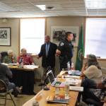 At a Langley city council meeting in June, Robert Glen Carpenter with the Pierce County Sheriffs office, and labled an expert in use of force by law enforcement officers, demonstrates proper handcuffing technique on Police Chief David Marks. By years end, both men lost their jobs.