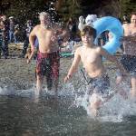 Brave souls head for the bone-chilling waters of Double Bluff Beach at the Polar Bear Dive of 2018. It happens again Tuesday. (File photo)
