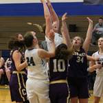 Lexi Starets-Foote rises above a crowd for 2 points.(Photo by Jim Waller/South Whidbey Record)