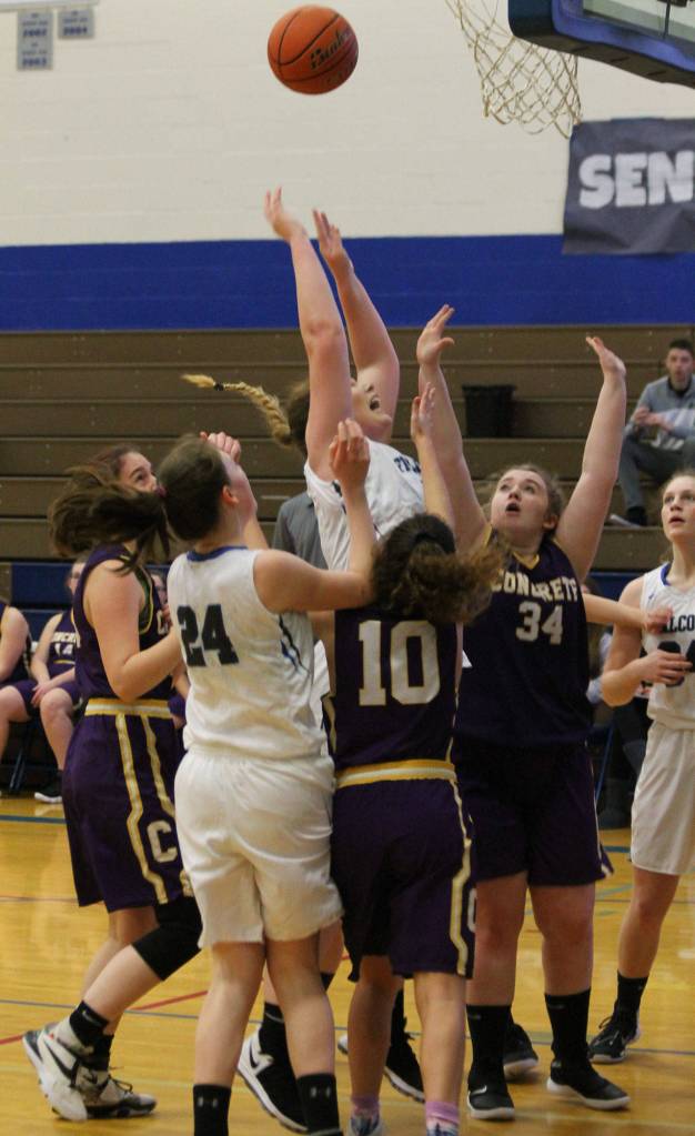 Lexi Starets-Foote rises above a crowd for 2 points.(Photo by Jim Waller/South Whidbey Record)
