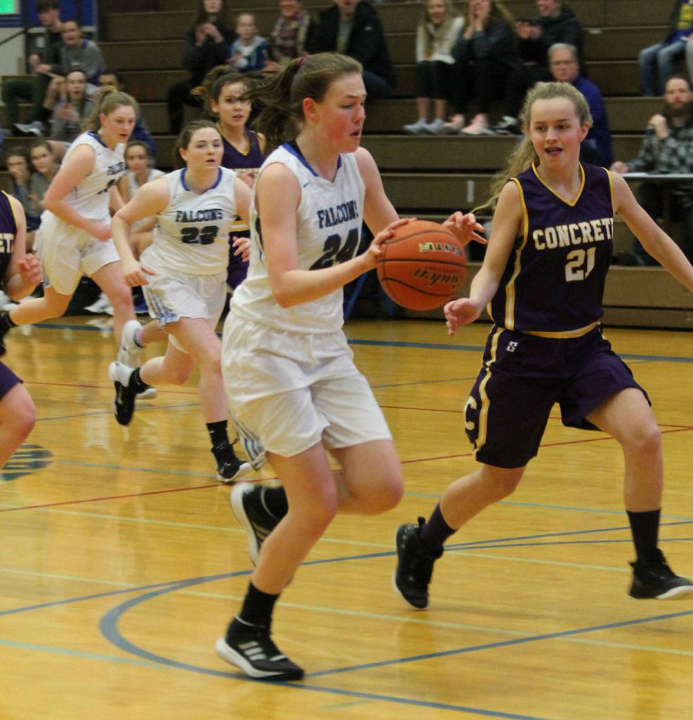 Falcon Ella Wood races by Concretes Sierra Rensink (21) on a fast break.(Photo by Jim Waller/South Whidbey Record)
