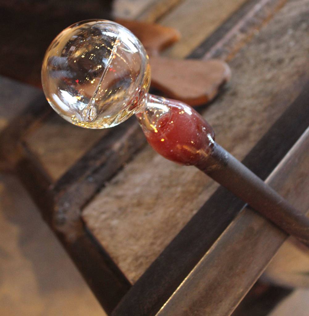 A clear bubble of a sea float before it swirls in color.