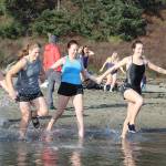 Tekoah Holland, left, Kristian Hurlburt, Carin Lodell and Sylvia Hurlburt head for a dunk.