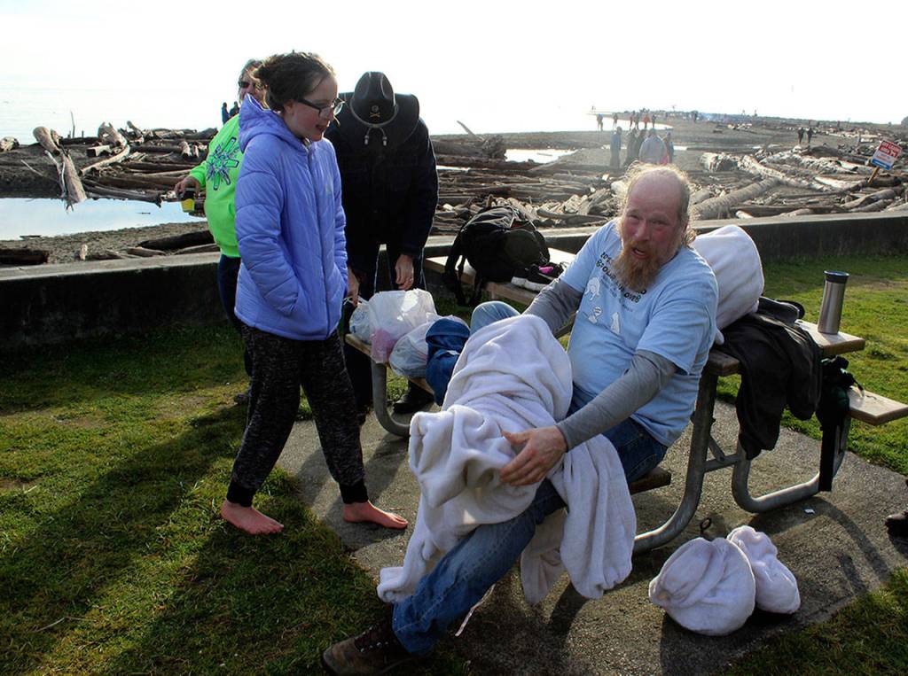 The event mascot changed his identity and suit a few times in order to take a plunge sans polar bear fur.
