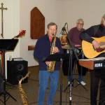 Playing during the annual MLK tribute at St. Augustines-in-the-Woods Episcopal Church are Ron Russell (bass) Danny Ward (saxophone) James Nevermann (percussion), Karl Olsen (guitar, keyboard, vocals).