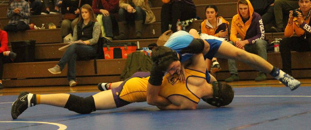 Dayton Birchfield, top, turns Friday Harbors Keagan Bailey.(Photo by Jim Waller/South Whidbey Record)