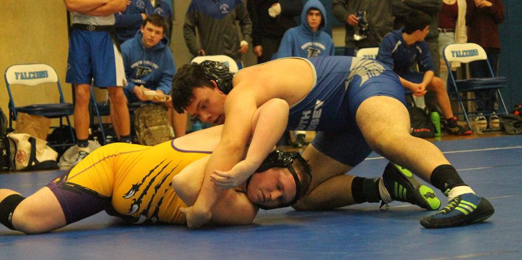 Dylan Davis, right, sets up Friday Harbors Weston Swertz for a fall. (Photo by Jim Waller/South Whidbey Record)