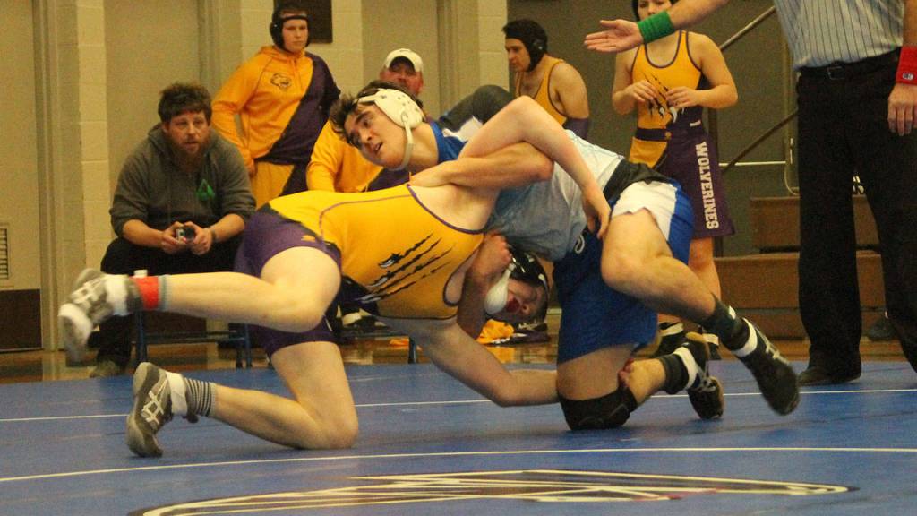 Clay OBrien, right, flips Friday Harbors Isaac Blumsickle. (Photo by Jim Waller/South Whidbey Record)