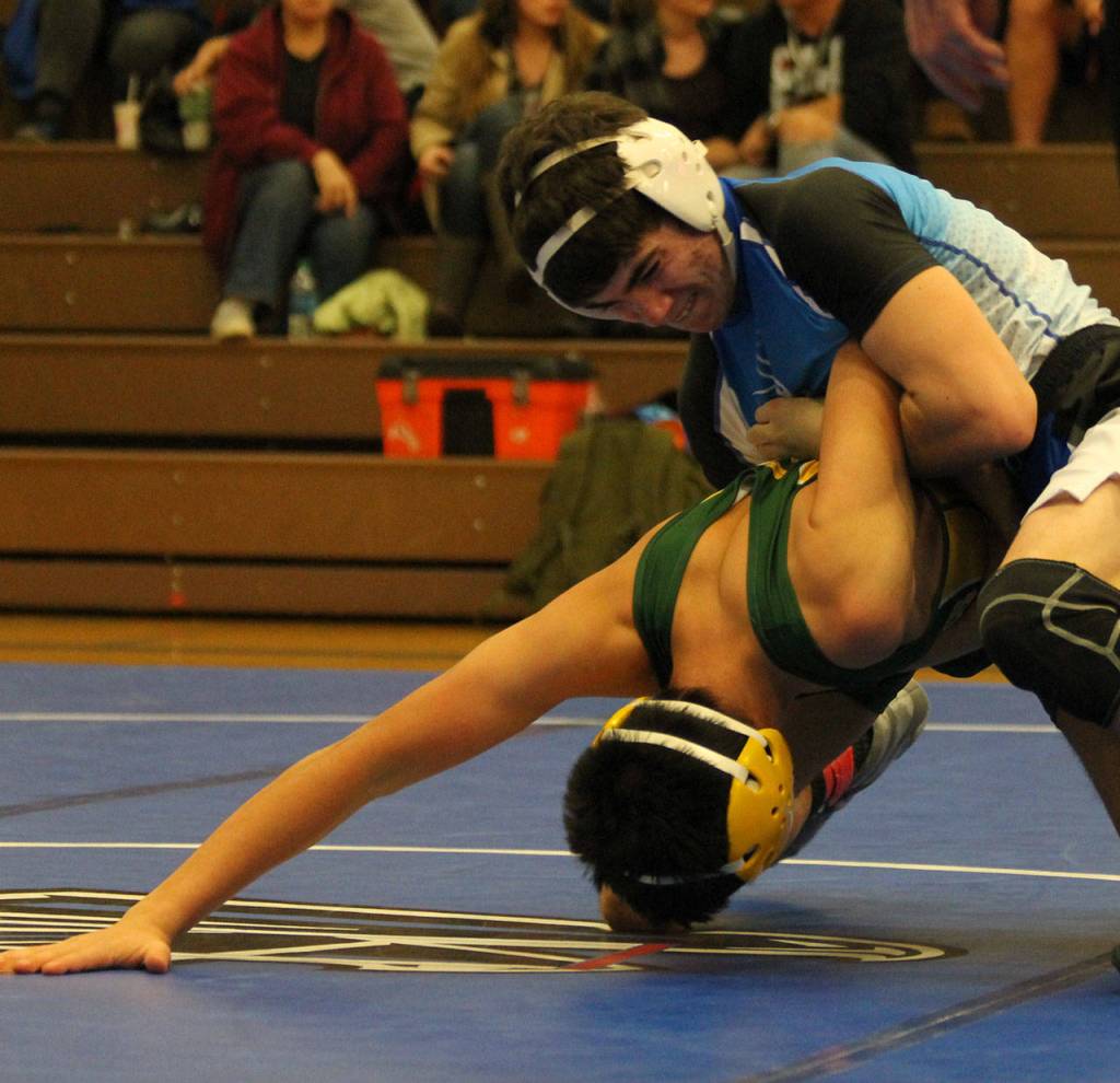 Jonathan Price, top, takes control in the Darrington match. (Photo by Jim Waller/South Whidbey Record)