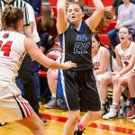 Kayla Knauer (22) looks for an open teammate as Coupevilles Lindsey Roberts defends.(Photo by John Fisken)