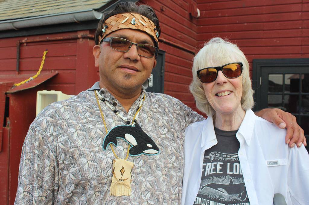 Lummi Nation councilman Fredrick Lane with Whidbey Island author Sandra Pollard at the 2018 ceremony for captured orcas. (Photo by Patricia Guthrie/Whidbey News Group)