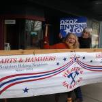 Partners in life and creativity, David Ossman and Judith Walcutt pose in front of Langleys Clyde Theatre with props for a March 16 benefit performance for South Whidbey Hearts & Hammers. (Photo by Patricia Guthrie/Whidbey News Group)