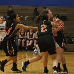 Ella Wood, center, draws a crowd of Granite Falls defenders on the way to the hoop.(Photo by Jim Waller/South Whidbey Record)