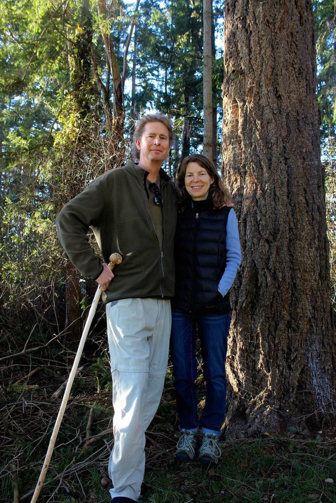 Craig and Joy Johnson in their Freeland backyard where they identified 80 species of birds and recorded behaviors for an educational video. Their new video explores habitats throughout Whidbey Island. (Photo by Patricia Guthrie/Whidbey News Group)