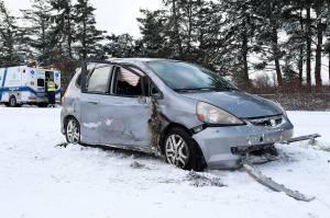 Two patients were transported to WhidbeyHealth Medical Center after a car rolled over on Engle Road Monday morning. Photo by Laura Guido/Whidbey News Group