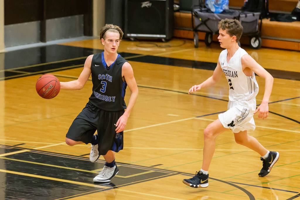 Kody Newman navigates Meridians press. (Photo by John Fisken)