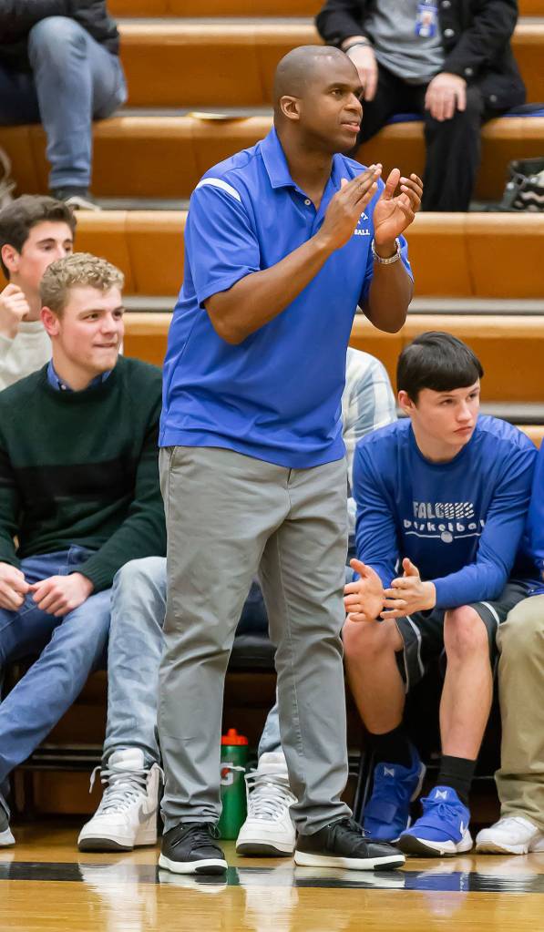 South Whidbey coach Mike Washington encourages his team.(Photo by John Fisken)
