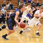 Nick Young races by Merdians Titus Bowler (20).(Photo by John Fisken)