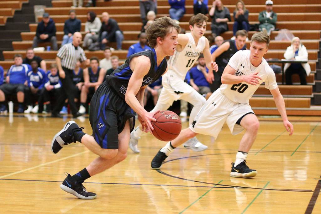 Nick Young races by Merdians Titus Bowler (20).(Photo by John Fisken)