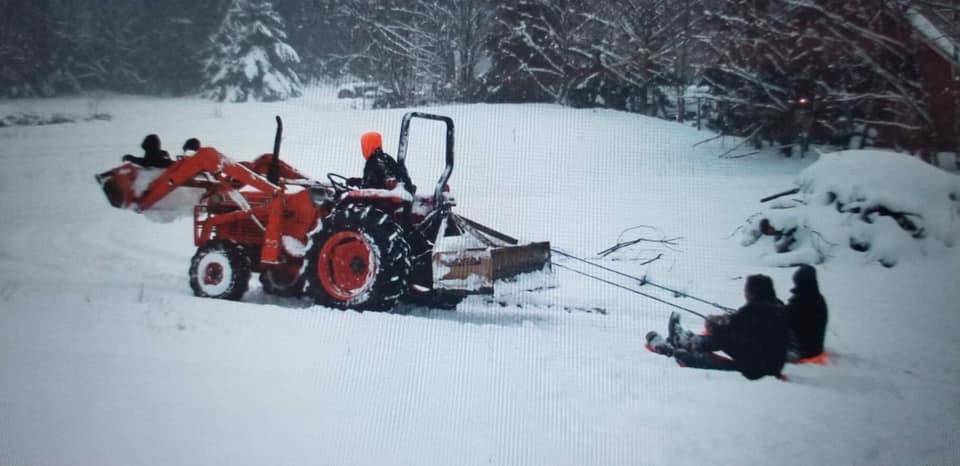 Helen Price Johnsons photo shows three generations having fun on a snowy Sunday.