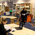 Senior Erin Brewer studied in the South Whidbey High School library using both a calculus text book and one of the 1,300 Chromebook computers bought with previous levy funding approved by voters. (Photo by Patricia Guthrie/Whidbey News Group)