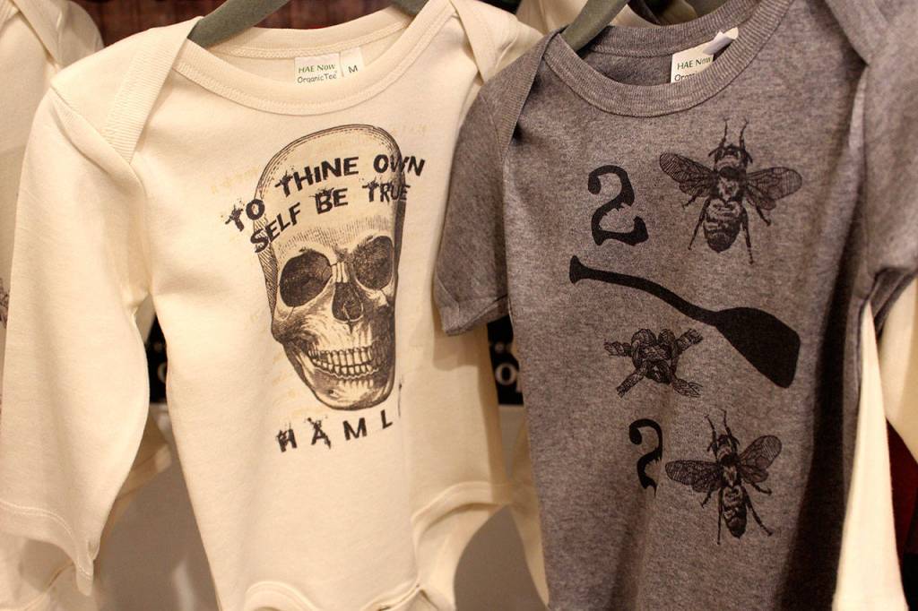 Shakespearean quotes adorn an assortment of clothing for sale at The Bards Boutique.