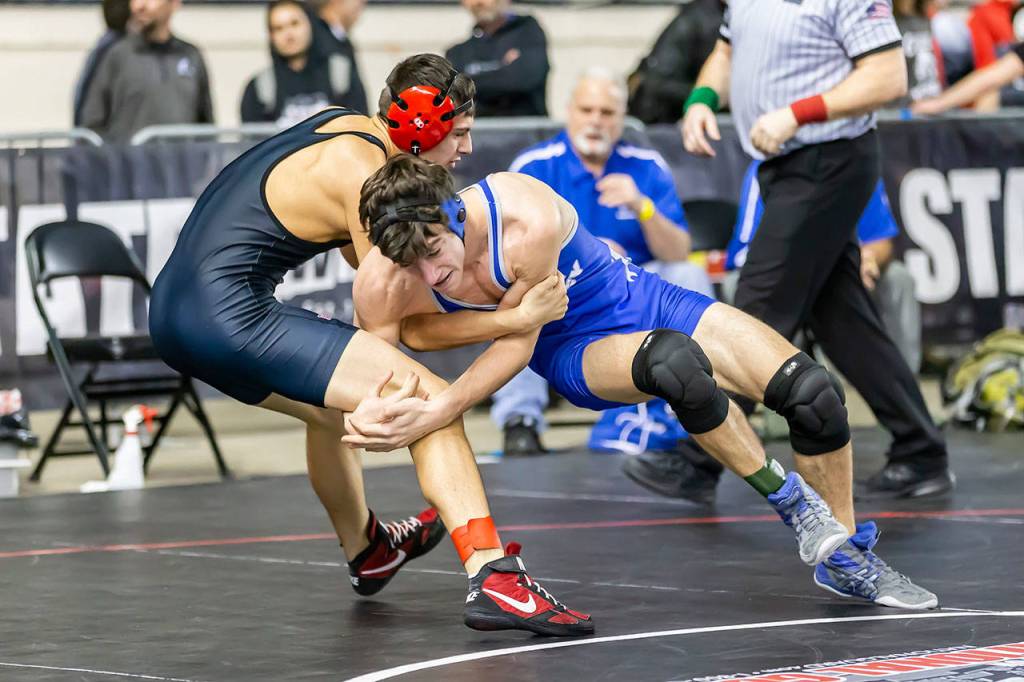 South Whidbeys Eden Batiste, right, goes for a reversal against Anthony Cardona of Omak.(Photo by John Fisken)