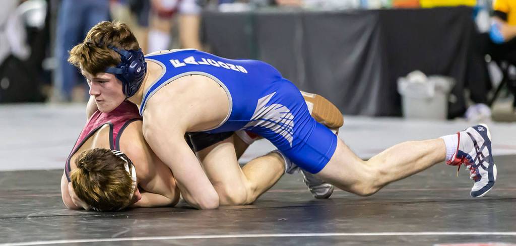 South Whidbeys Caleb McArthur controls Nate Allen of Newport.(Photo by John Fisken)