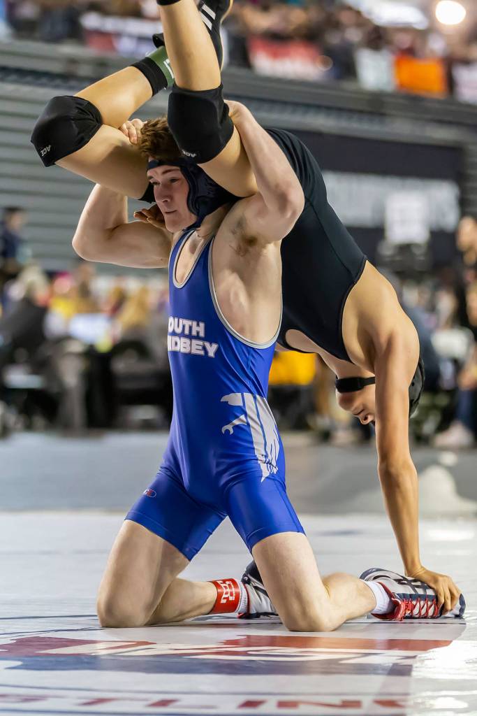 McArthur tries to flip Erik Bucio of Klahowya.(Photo by John Fisken)