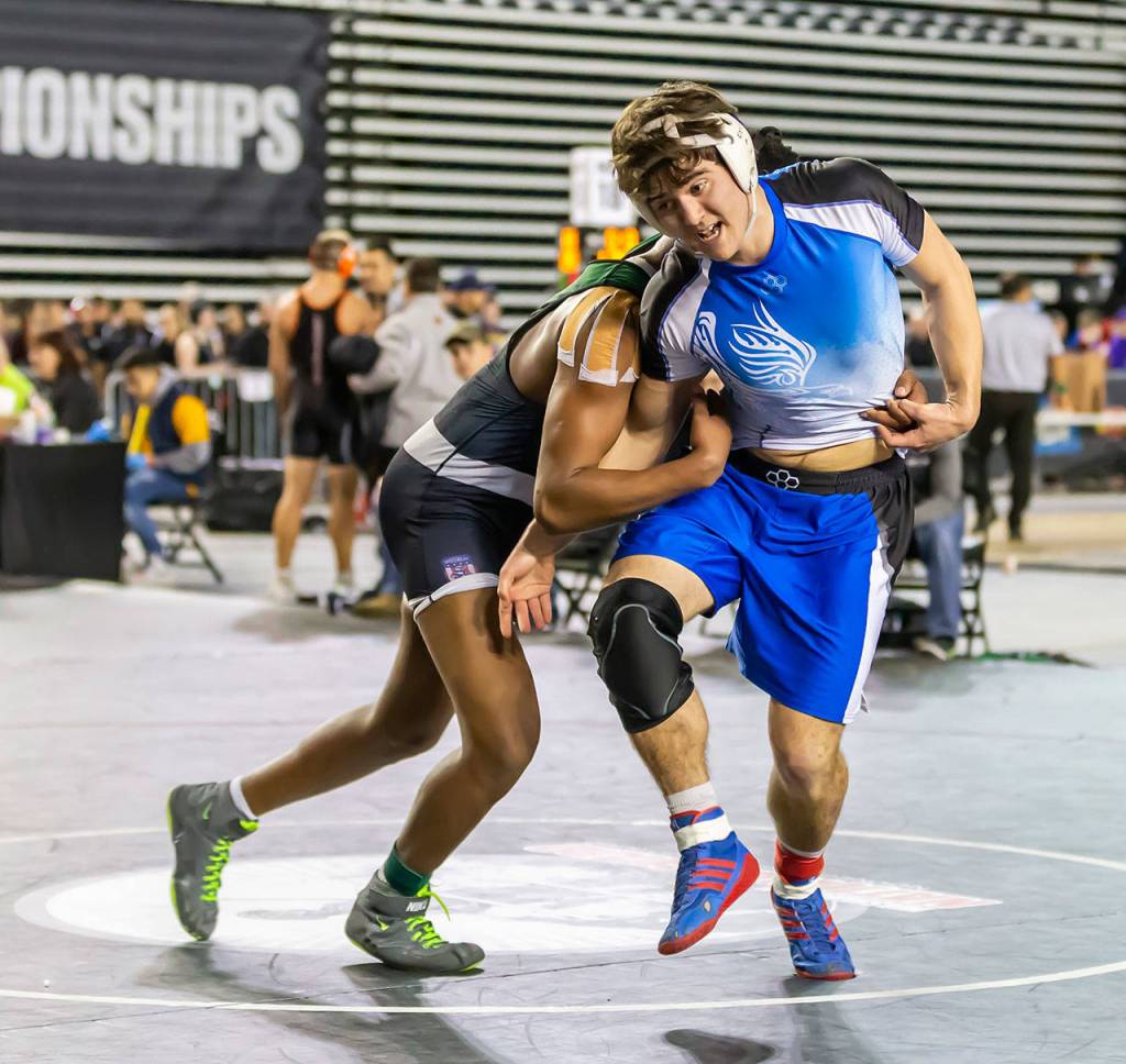 OBrien tries to escape from Adesalem Jelinek of Lakeside-Nine Miles Fall.(Photo by John Fisken)