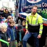 Phil Whitlock, driver with Island Disposal, answers questions about garbage trucks to wide-eyed preschool pupils of South Whidbey Childrens Center. The company visited the Langley school Tuesday. (Photos by Patricia Guthrie/Whidbey News Group)