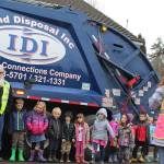 Island Disposal brings one of its garbage trucks to South Whidbey Childrens Center to give little kids a big thrill. Observed parent Caitlin Voss, Theyre obsessed with garbage trucks and recycling trucks. (Photo by Patricia Guthrie/Whidbey News Group)