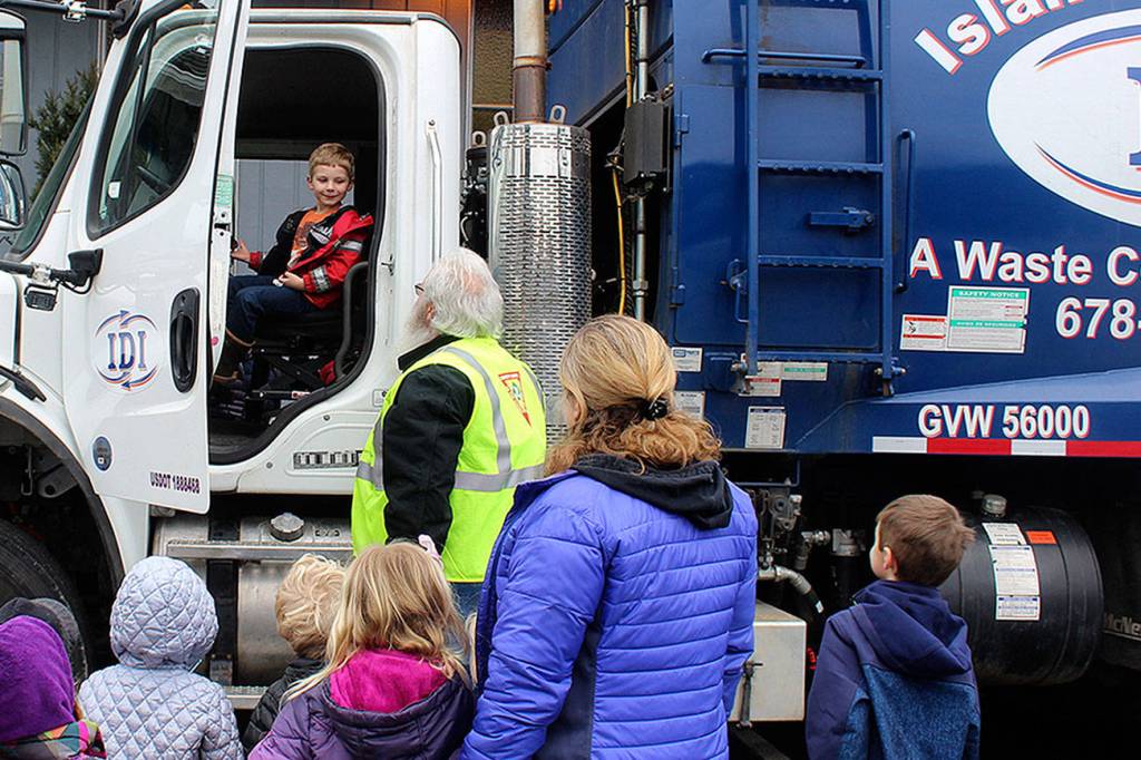 Many opted to get a view from the drivers seat during Tuesdays visit. Our children love playing trash pick up, explained Kris Barker, preschool executive director. The trash truck workers are like super heroes to them.