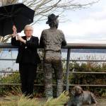 Josh Hauser, one of two longtime Mystery Weekend characters, poses with Langleys Boy and Dog statute.                                (Photo by Patricia Guthrie/Whidbey News Group)