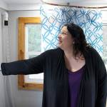 (Photo by Laura Guido/Whidbey News Group)                                Amber Truex, program manager at Ryans House for Youth, flips on the lights in a micro-home donated to the youth organization by the Oak Harbor High School robotics team.