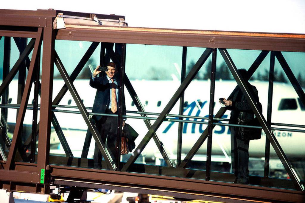 Passengers board a plane at Paine Field terminal on opening day. (Photo by Andy Bronson/The Everett Daily Herald)