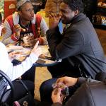 Friends who came in from Oak Harbors Navy base to solve Mystery Weekends crime collectively lined up clues on a table at Sweet Monas while enjoying some sweets. Left to right are Christina Sargent, Akiyah Salmon, William Joyette and Jose Aguilar. We came for gelato and the Mystery Weekend, Joyette said. (Photo by Patricia Guthrie/Whidbey News Group)