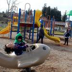 Ren Gonzalez, almost 4, expresses the joy of piloting a whale plane in the sunshine Sunday as his older brother Michi looks on. The family from Clinton took in the warm weather at Freeland Park. (Photo by Patricia Guthrie/Whidbey News Group)