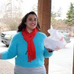 Crystal Aguilar, owner and founder of Whidbey Waiter, makes a delivery at a Coupeville office. Her business also delivers groceries, flowers, takes trash to the dump and makes Costco runs for its customers. Photo by Laura Guido/Whidbey News Group