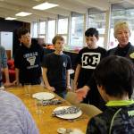 Mary Lou Whisenand teaches how to set a table, one of many life skills middle school students acquire during Learning Lab activities.