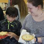Jamie Dale, left, compares chicken pot pies with Madi Rowland. Many students said theyd try the recipe at home.