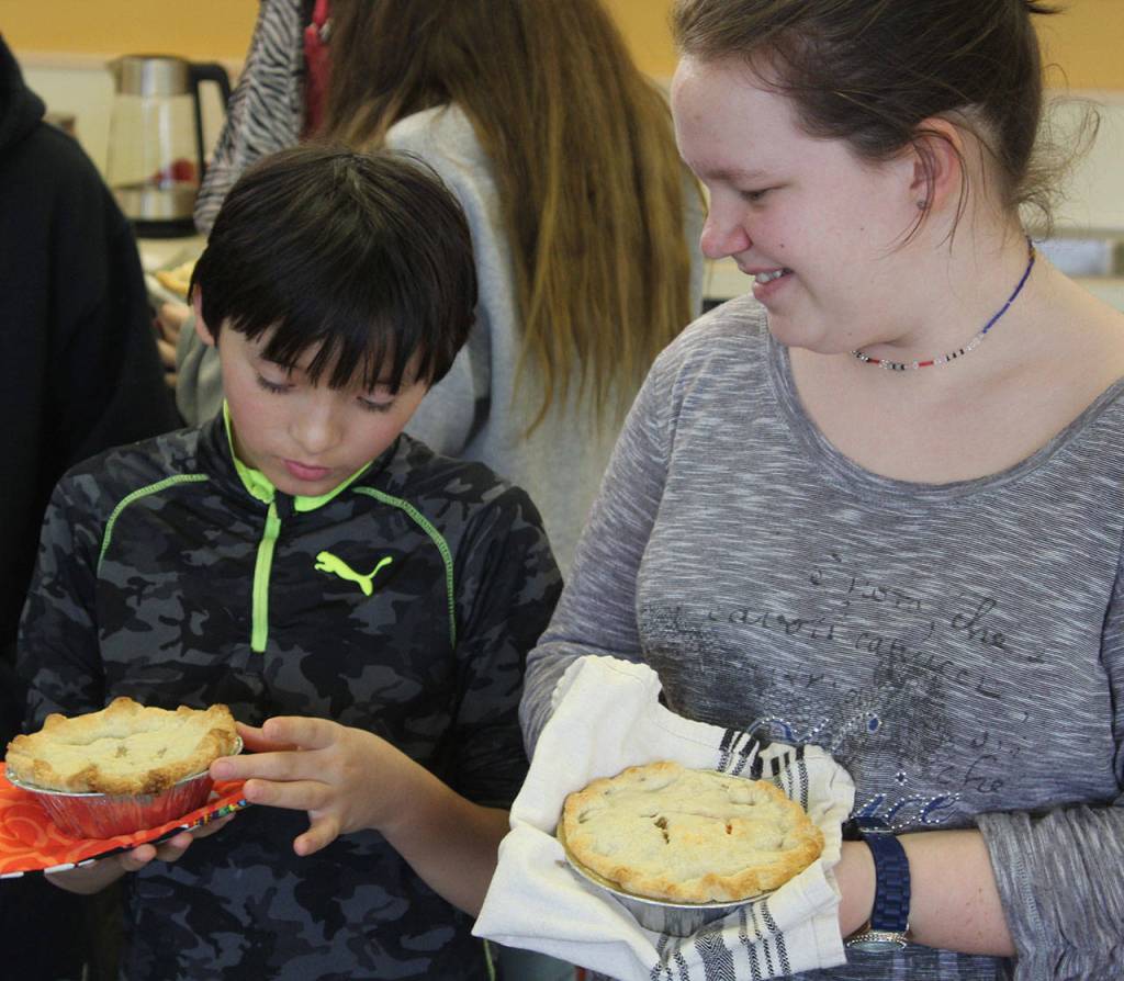 Jamie Dale, left, compares chicken pot pies with Madi Rowland. Many students said theyd try the recipe at home.