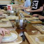 Students put finishing touches on chicken pot pies.