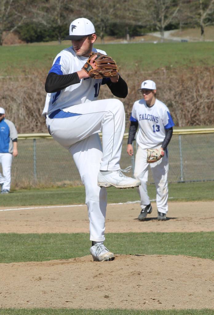 Brent Batchelor loads up to fire a pitch at Chimacum.(Photo by Jim Waller/Sound Whidbey Record)